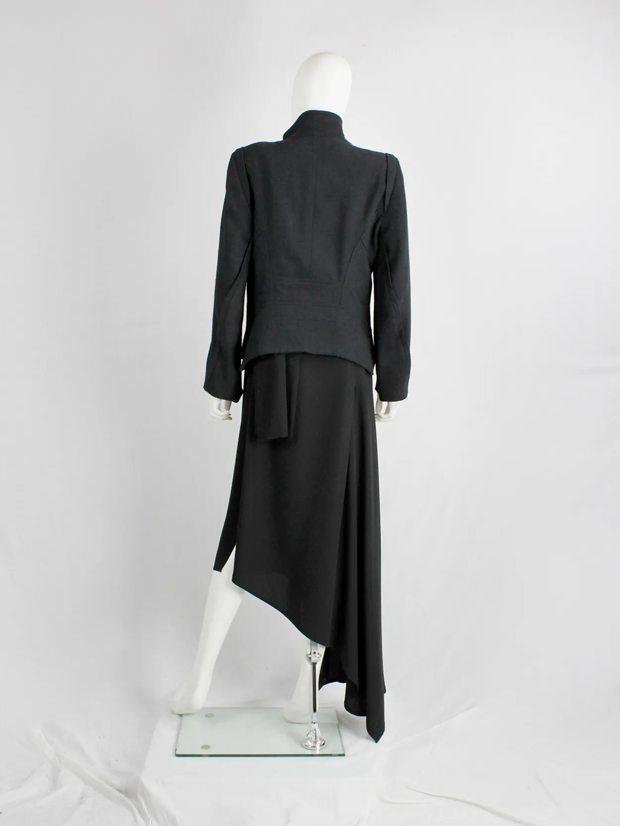 Ann Demeulemeester black coat with standing neckline and asymmetric button closure — fall 2010